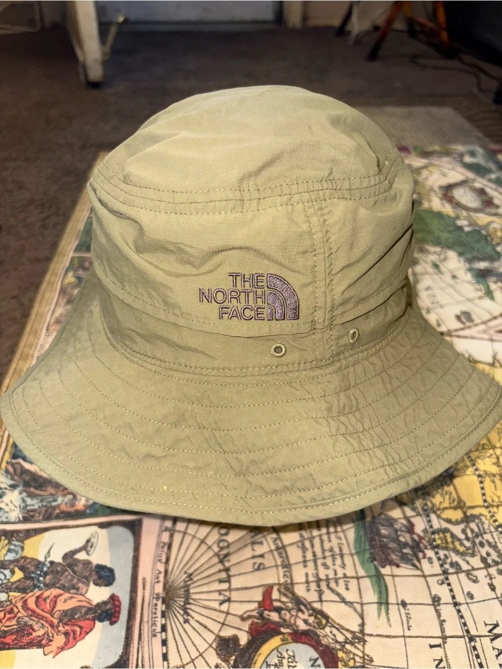 The North Face Olive Green Bucket Hat with Yellow Bird Patch